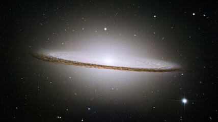 The Sombrero galaxy, Messier 104 (M104) from Hubble telescope. The galaxy's hallmark is a brilliant...