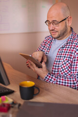 UX designer using tablet computer