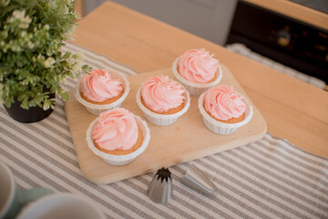 beautiful pink cakes are on the table, on a stand