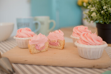 beautiful pink cakes are on the table, on a stand