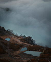 Peaceful morning in the mountain . house in the autumn mountain above the clouds