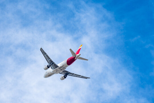 Airbus A319 passenger aircraft of the airline Iberia flying after takeoff