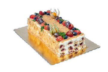 Festive New Year and Christmas cake with monastic cherries in the form of a hut. on a white background.