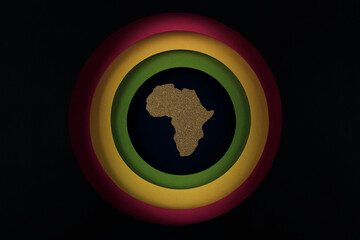 Black History Month concept. Africa Continent shape with traditional red, yellow and green color bar. Copy space. Flat lay.