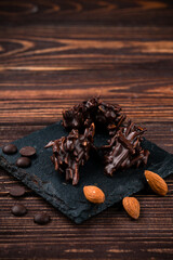 almonds in dark chocolate close up
