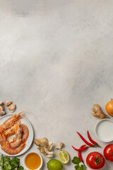 Fresh beautiful ingredients for delicious tom yum soup on a light background