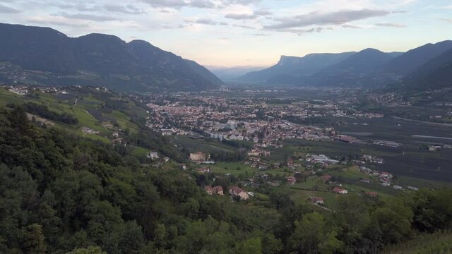Slow pan right across the Merano valley at dusk, Italy