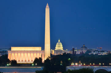 Washington D.C. skyline at night with Lincoln memorial and the monument and capitol buildings in...