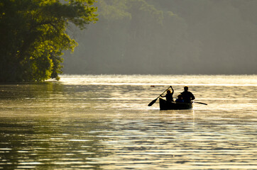 A family enjoys boat ride in Potomac River during sunset - Washington DC United States