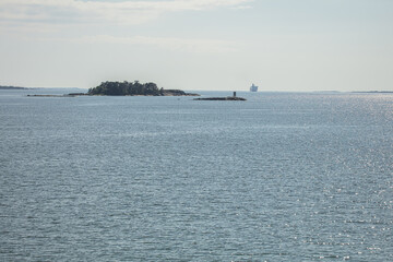 Between islands cruise ferry at sea. Summer, sunny day Nature of Scandinavia. islands in the sea. Finland. Turku Archipelago