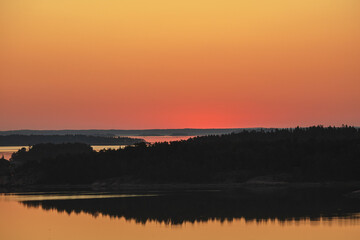 Early summer dawn over the sea. Nature of Scandinavia. islands in the sea. Finland. Turku Archipelago.