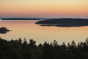 Early summer dawn over the sea. Nature of Scandinavia. islands in the sea. Finland. Turku Archipelago.