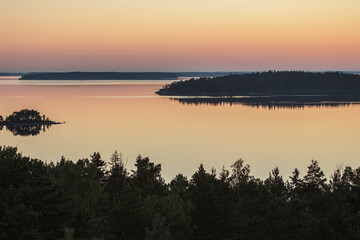 Early summer dawn over the sea. Nature of Scandinavia. islands in the sea. Finland. Turku Archipelago.