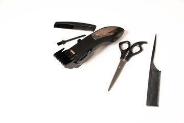 flat lay with hair clipper and hairdressing tools, on white