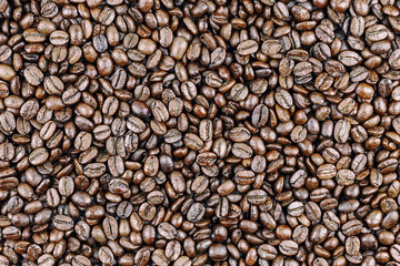 large number of roasted dark coffee beans, ideal for cafe or menu design, top view