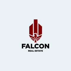 building logo design with silhouette falcon graphic for real estate