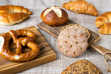 Various types of bread, buttery croissants, breads, rolls, baguettes, Fresh baked goods