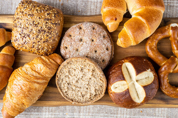 Various types of bread, buttery croissants, breads, rolls, baguettes, Fresh baked goods