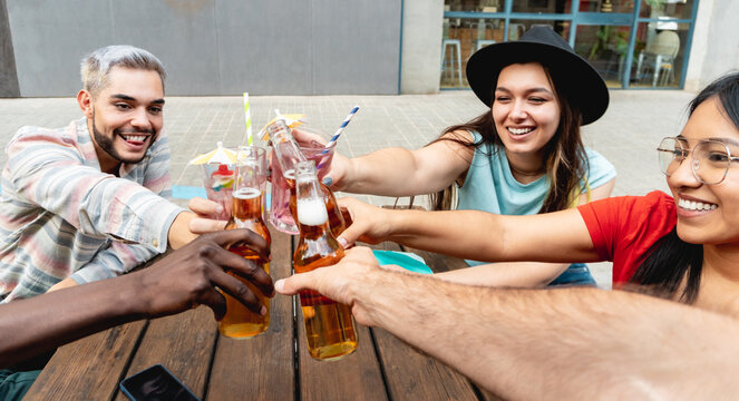 Young Friends Having Fun During Happy Hour Drinking Beer At Brewery Bar Restaurant - Festive, Holiday Fun Concept