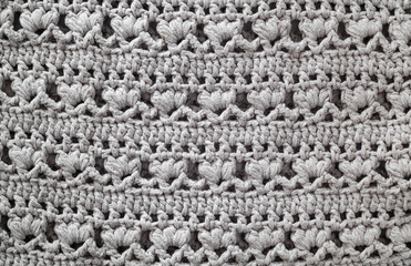 Knitted texture. Crocheted floral pattern.