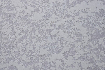 Vintage background with texture of embossed plaster in gray color