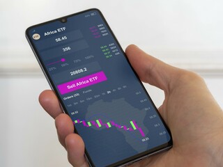Stock exchange etf african market chart, shares market datas on smartphone. Business analysis of an africa ETF