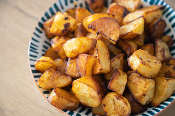 Roasted potatoes served in bowl