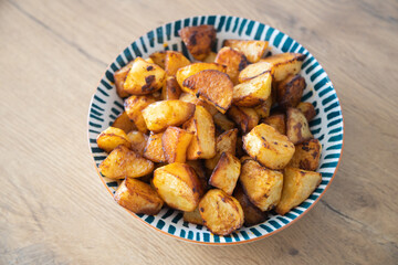 Roasted potatoes served in bowl