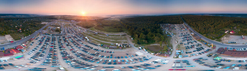 Aerial photo panorama by drone copter of the automotive market of used cars, the largest in Western Ukraine, Europe. Morning, foggy sunrise, salespeople gather for their business. Spherical panorama 3