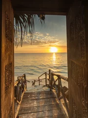 Foto op Aluminium Beautiful dor way to white beach with sunrise in background. Zanzibar © danmir12