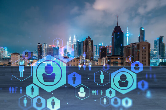 Rooftop with wooden terrace, Kuala Lumpur night skyline. Recruitment process to hire candidates for international business consulting. HR, networking digital icons. City downtown. Double exposure.
