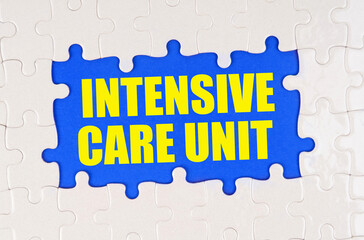 Inside the white puzzles on a blue background it is written - intensive care unit