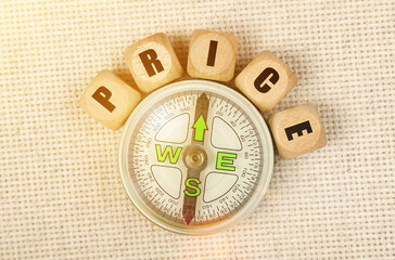 On the table is a compass and cubes with the inscription - PRICE