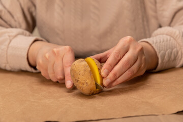 heart shaped potato stamp on craft paper. The process of decorating a gift for Valentine's Day. Getting ready for the celebration on February 14th.