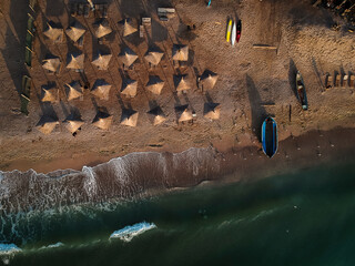Aerial view of amazing beach with umbrellas and turquoise sea at sunrise. Black Sea at Vama Veche, Romania - 480786608