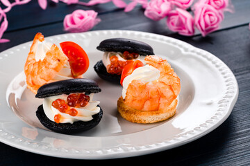 tartlets with red caviar on a plate