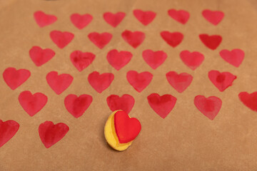 heart shaped potato stamp on craft paper. The process of decorating a gift for Valentine's Day. Getting ready for the celebration on February 14th.