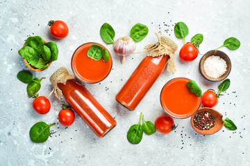 Tomato background. Tomato juice, tomato paste and tomato cocktail. Top view. On a stone background.
