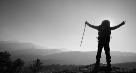 An silhouette of an accomplished mountain hiker in the Himalayan mountains