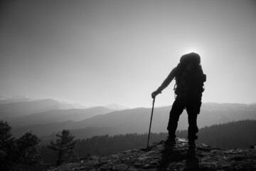 An silhouette of an accomplished mountain hiker in the Himalayan mountains