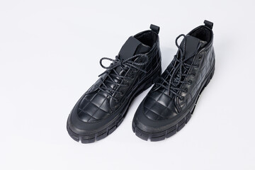 Men's leather short boots on a white background. Winter boots collection 2022