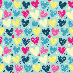 Seamless pattern with polka dot hearts and keys.