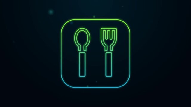 Glowing neon line Fork and spoon icon isolated on black background. Cooking utensil. Cutlery sign. 4K Video motion graphic animation