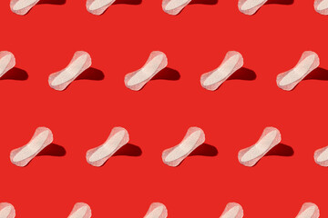 White menstrual pads on a red background. Seamless repeating pattern.