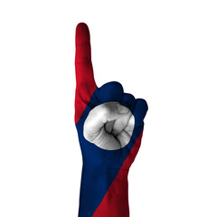 Hand pointing thumb up direction, laos painted with flag as symbol of up direction, first and number one symbol - isolated on white background