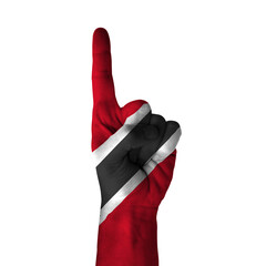 Hand pointing thumb up direction, trinidad painted with flag as symbol of up direction, first and...