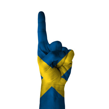 Hand pointing thumb up direction, sweden painted with flag as symbol of up direction, first and number one symbol - isolated on white background