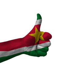 Hand making thumbs up sign, suriname painted with flag as symbol of thumbs up, like, okay, positive  - isolated on white background