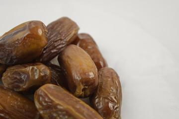 Dried dates  on white background.