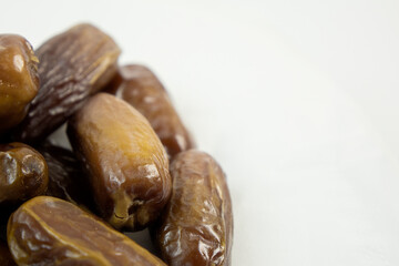 Dried dates  on white background.